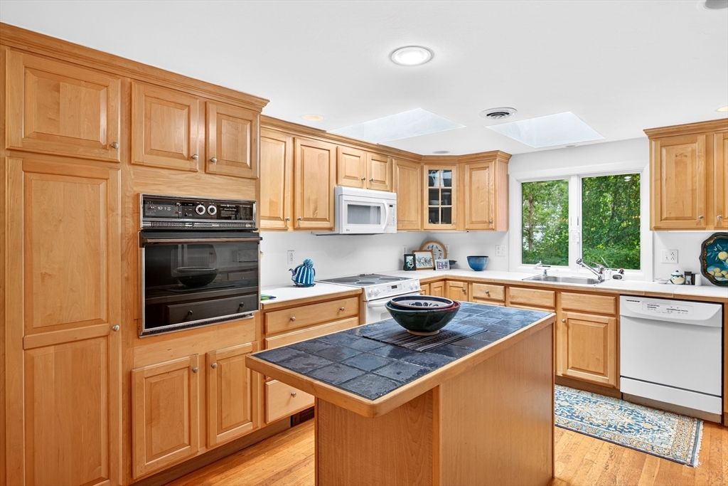 Interior, Kitchen, Recessed Lighting, Tile Countertops, Wood Texture Flooring