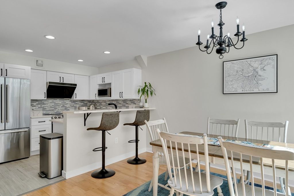 Chandelier, Dining room, Interior, Kitchen, Recessed Lighting, Stainless Steel Appliances, Wood Texture Flooring