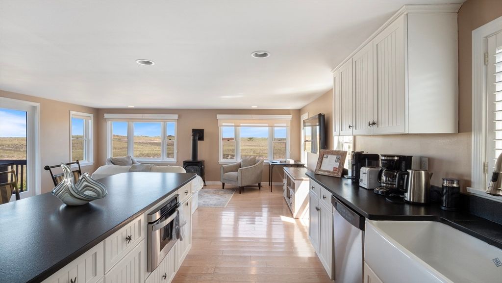 Dining room, Interior, Kitchen, Living room, Recessed Lighting, Water, Wood Texture Flooring