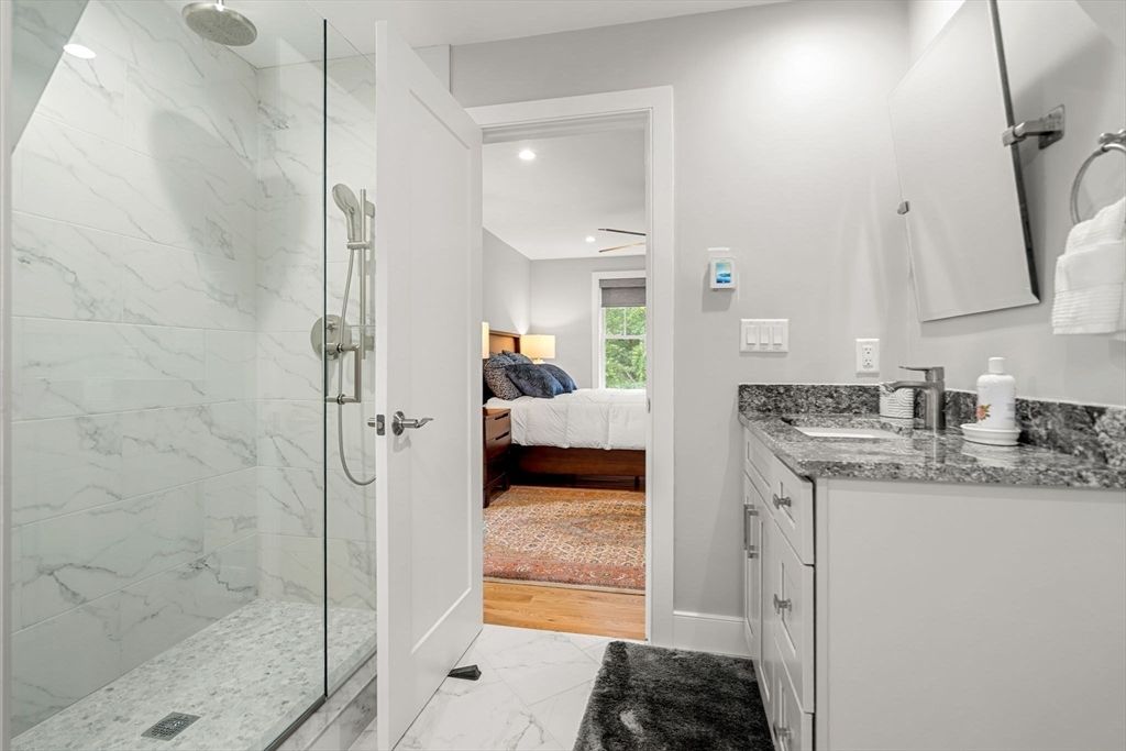 Bathroom, Bedroom, Glass Shower, Interior, Marble, Marble Walls, Recessed Lighting, Wood Texture Flooring