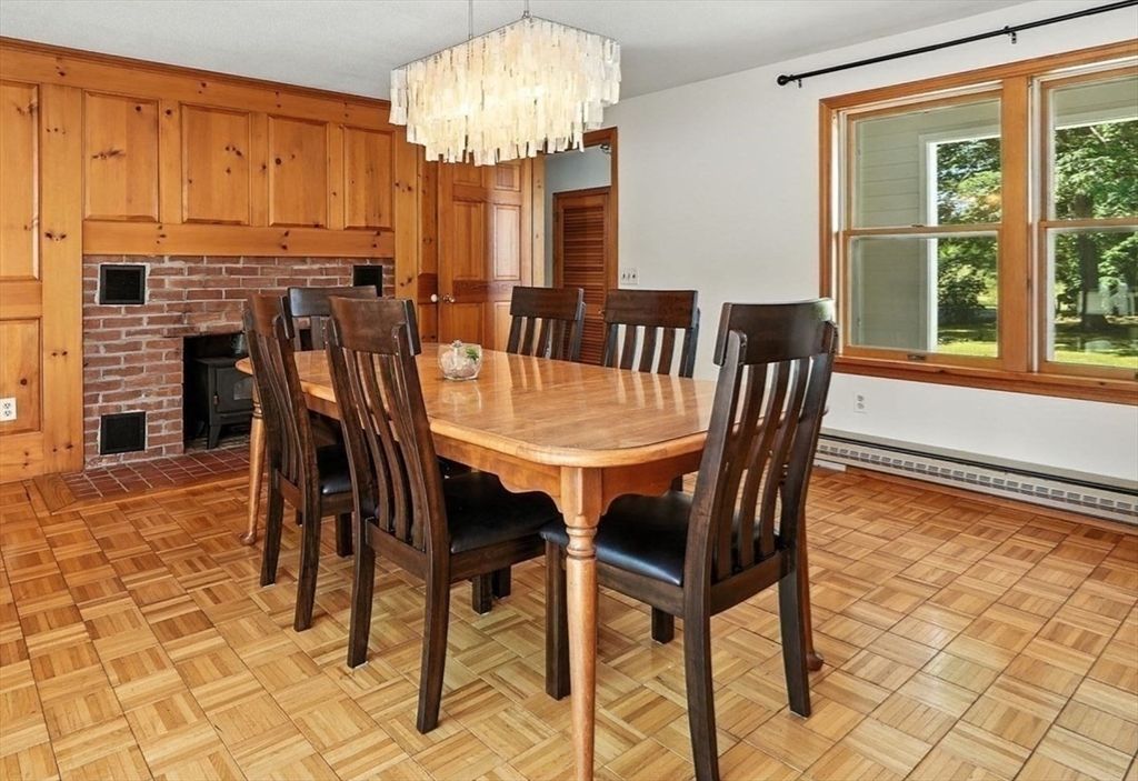 Chandelier, Dining room, Fireplace, Interior, Stone Walls, Wood Texture Flooring