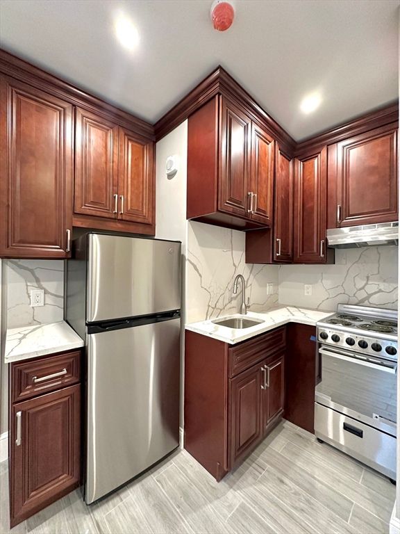 Interior, Kitchen, Marble Walls, Recessed Lighting, Stainless Steel Appliances, Wood Texture Flooring