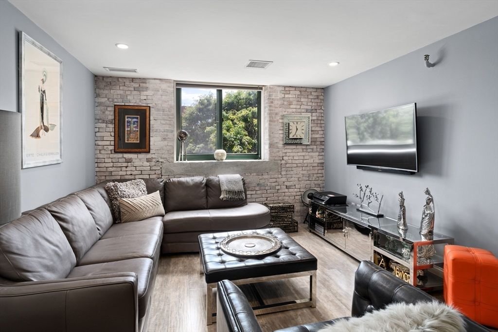 Fireplace, Interior, Living room, Recessed Lighting, Stone Walls, Wood Texture Flooring