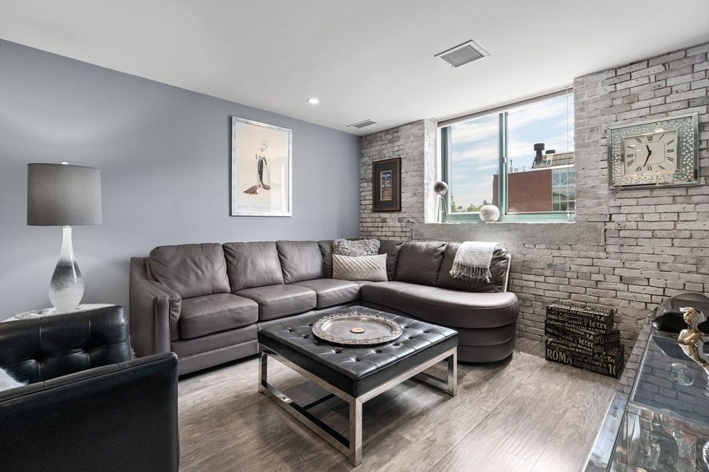 Fireplace, Interior, Living room, Recessed Lighting, Stone Walls, Wood Texture Flooring