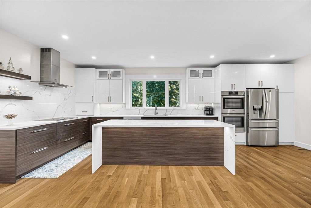 Interior, Kitchen, Marble Walls, Recessed Lighting, Stainless Steel Appliances, Wood Texture Flooring