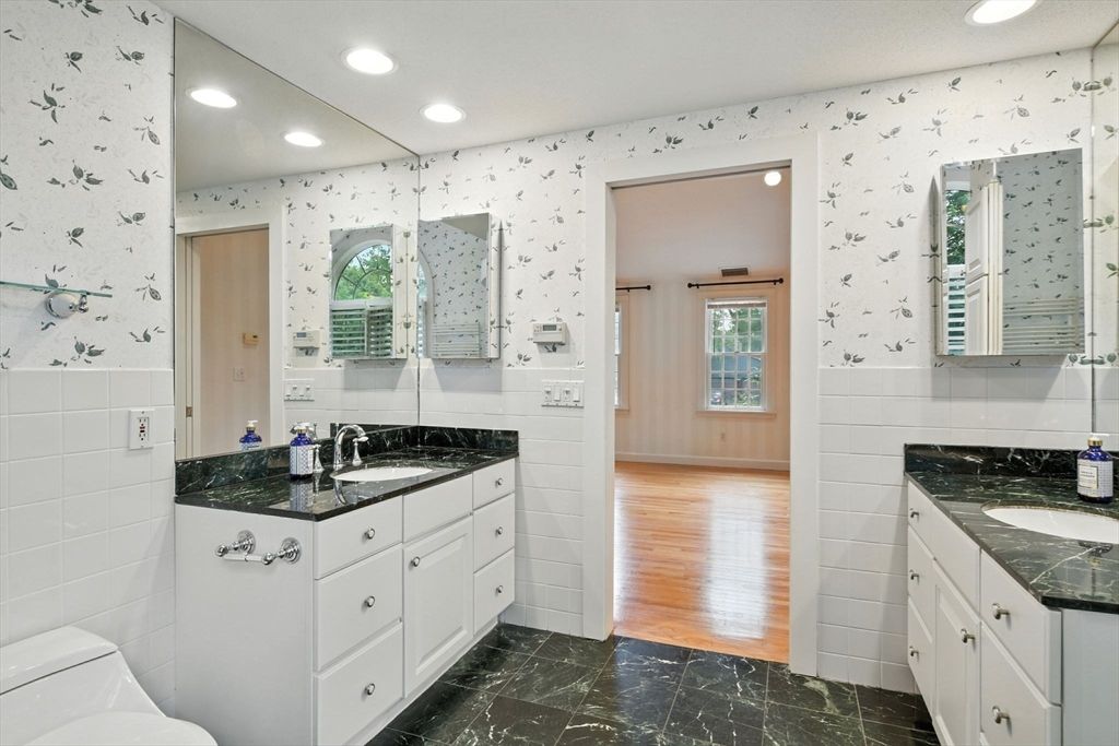 Bathroom, Dual Sink Vanities, Interior, Marble, Recessed Lighting, Wood Texture Flooring
