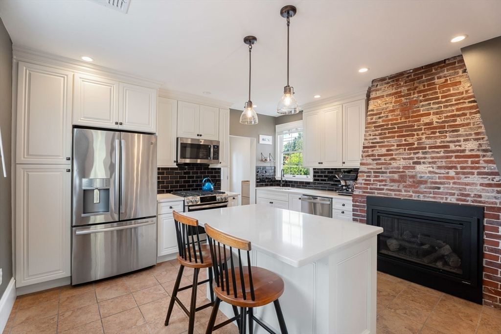 Fireplace, Interior, Kitchen, Pendant Lights, Recessed Lighting, Stainless Steel Appliances, Stone Walls