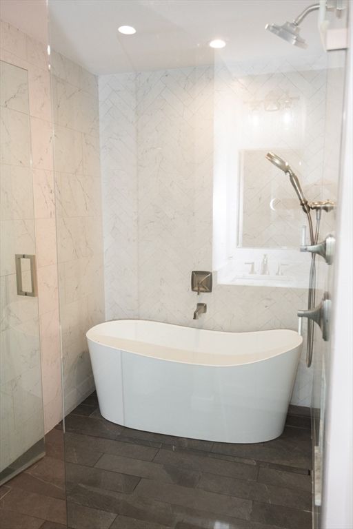 Bathroom, Free Standing Baths, Glass Shower, Interior, Marble Walls, Recessed Lighting