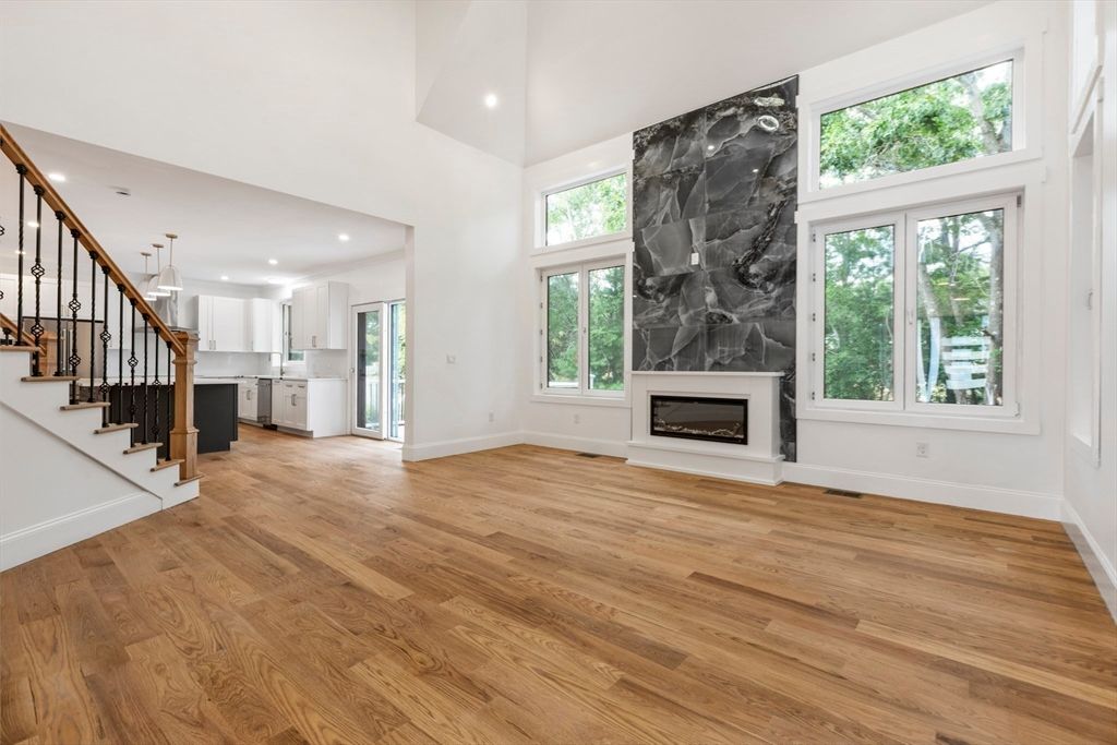 Empty room, Fireplace, Interior, Kitchen, Marble Walls, Pendant Lights, Recessed Lighting, Wood Texture Flooring