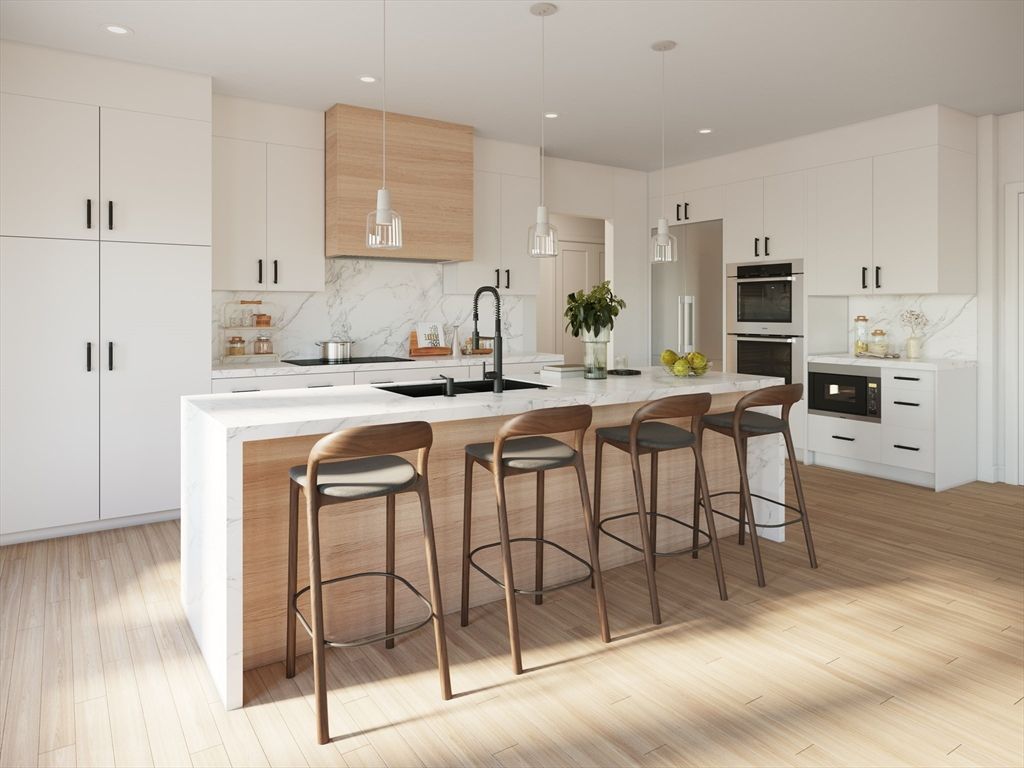 Interior, Kitchen, Marble Walls, Pendant Lights, Recessed Lighting, Stainless Steel Appliances, Wood Texture Flooring