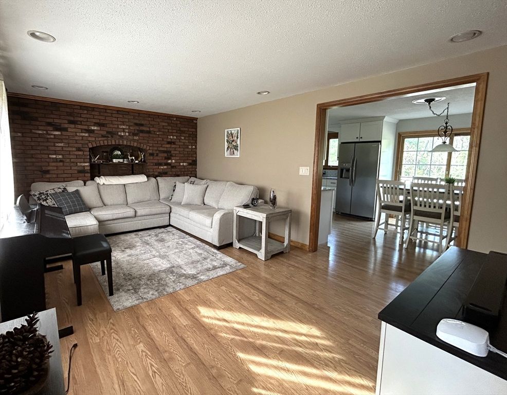 Dining room, Interior, Living room, Recessed Lighting, Stone Walls, Wood Texture Flooring