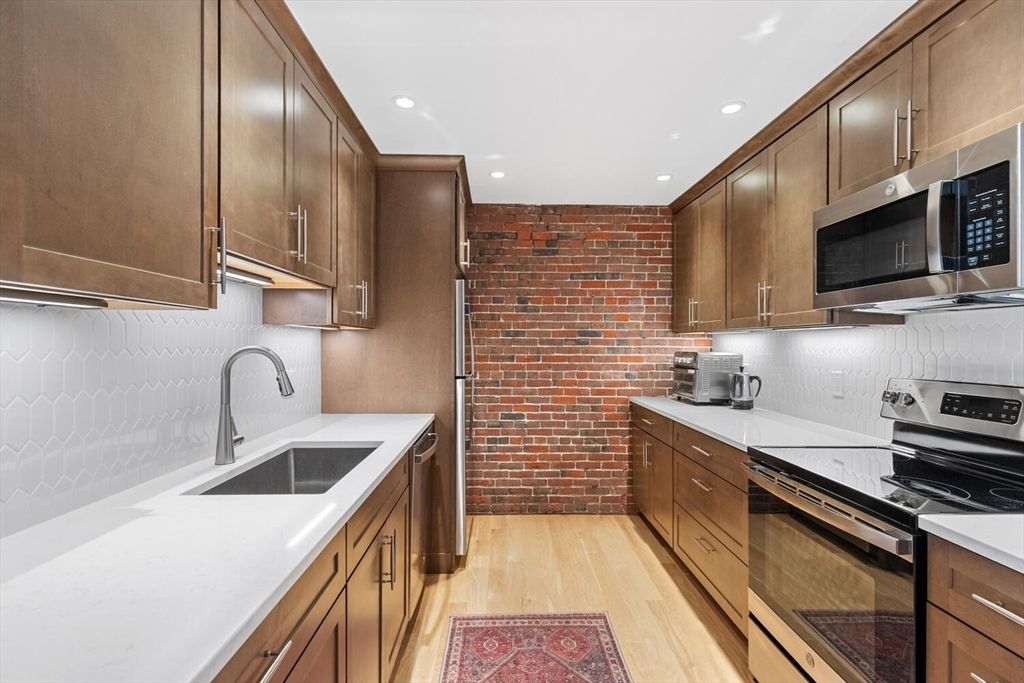 Interior, Kitchen, Recessed Lighting, Stainless Steel Appliances, Stone Walls, Wood Texture Flooring