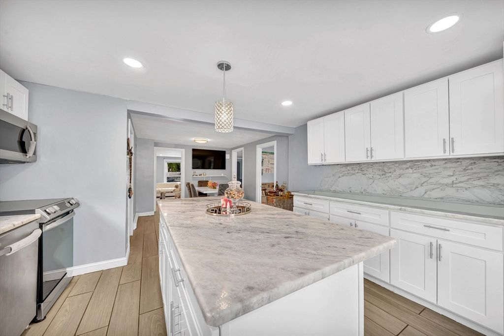Interior, Kitchen, Marble Walls, Pendant Lights, Recessed Lighting, Wood Texture Flooring