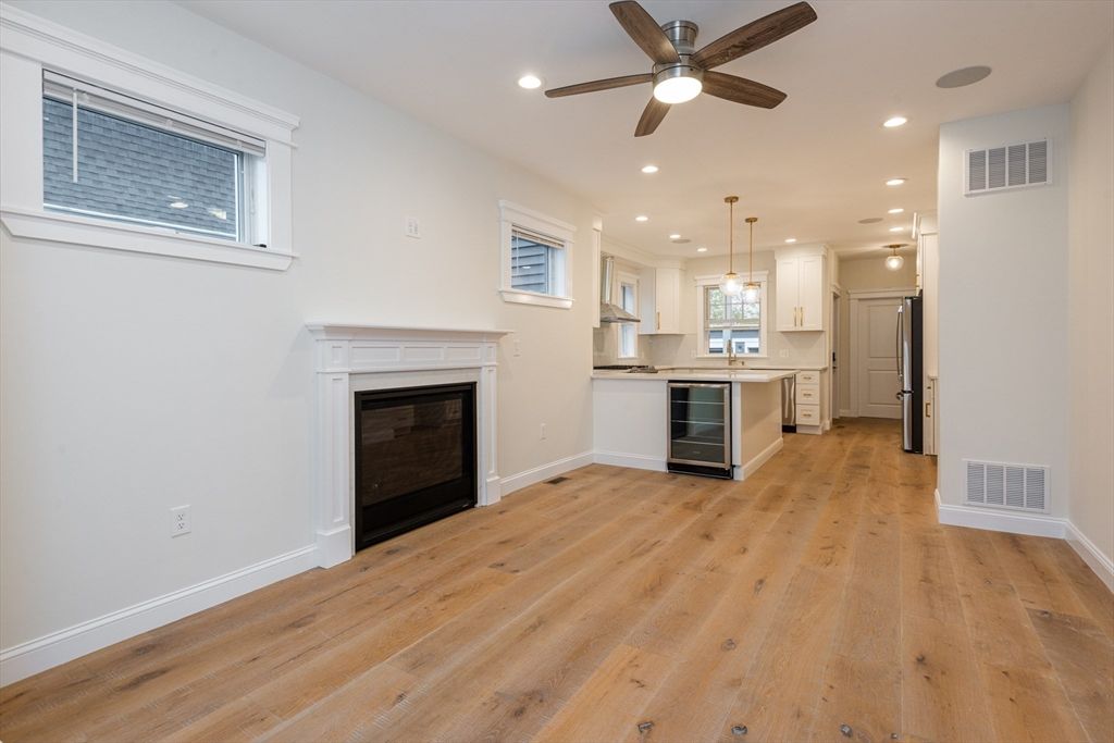 Empty room, Fireplace, Interior, Kitchen, Pendant Lights, Recessed Lighting, Wood Texture Flooring