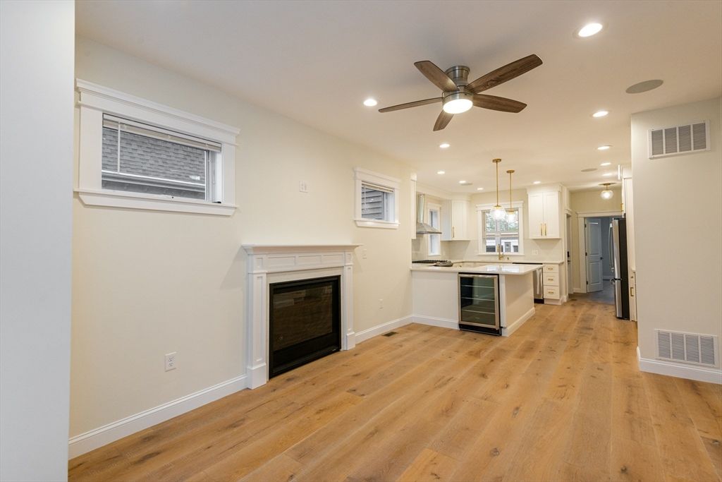 Empty room, Fireplace, Interior, Kitchen, Pendant Lights, Recessed Lighting, Wood Texture Flooring
