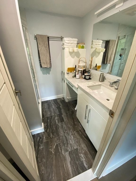 Bathroom, Dual Sink Vanities, Interior, Marble, Marble Walls, Wood Texture Flooring