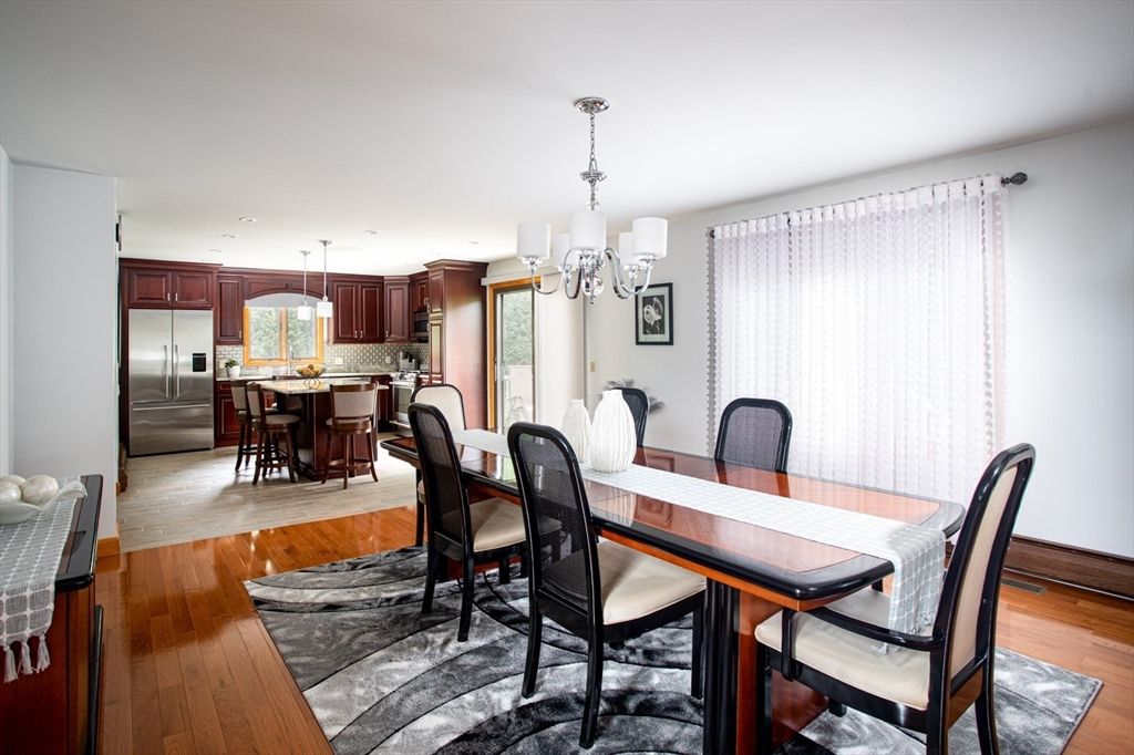 Chandelier, Dining room, Interior, Kitchen, Recessed Lighting, Stainless Steel Appliances, Wood Texture Flooring