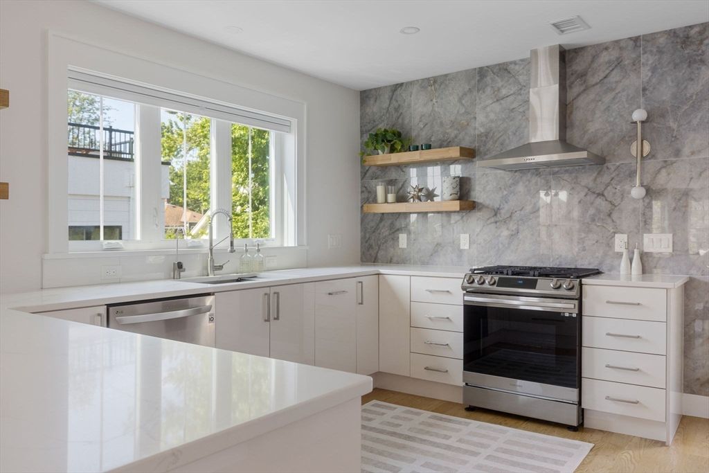 Interior, Kitchen, Marble Walls, Recessed Lighting, Stainless Steel Appliances, Wood Texture Flooring
