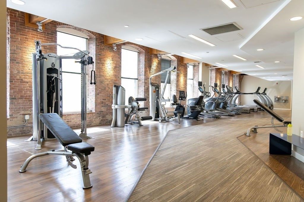 Fitness Equipment, Gym, Interior, Recessed Lighting, Stone Walls, Wood Texture Flooring