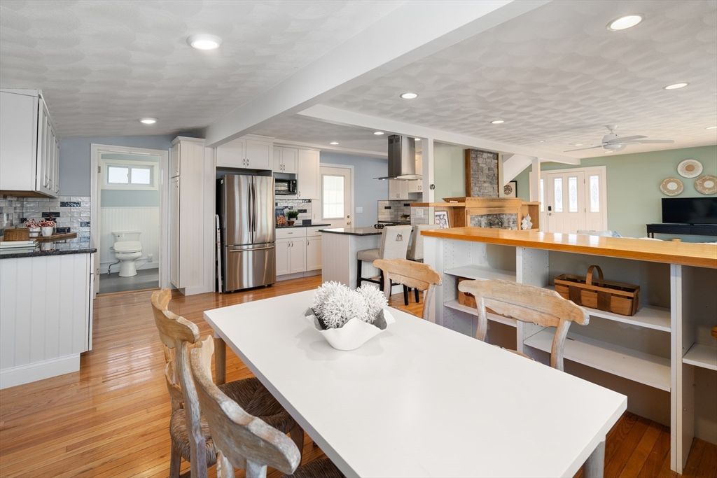 Dining room, Interior, Kitchen, Recessed Lighting, Stainless Steel Appliances, Wood Texture Flooring