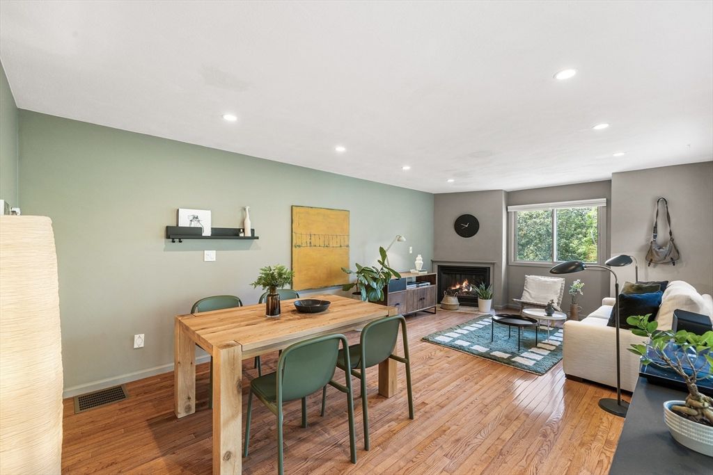 Dining room, Fireplace, Interior, Living room, Recessed Lighting, Wood Texture Flooring