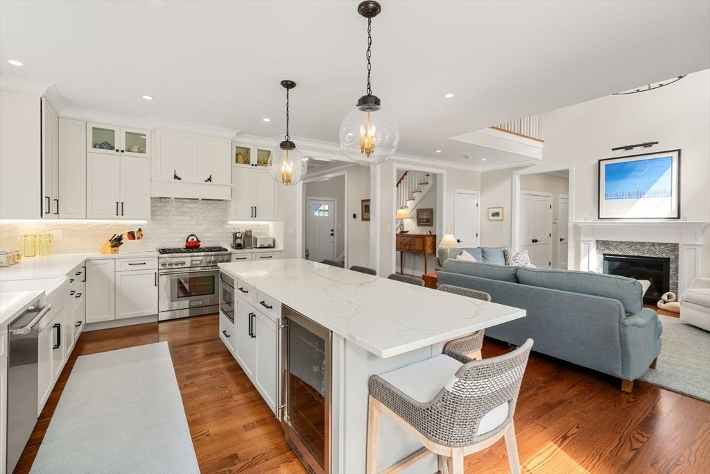 Fireplace, Interior, Kitchen, Living room, Pendant Lights, Recessed Lighting, Stainless Steel Appliances, Wood Texture Flooring