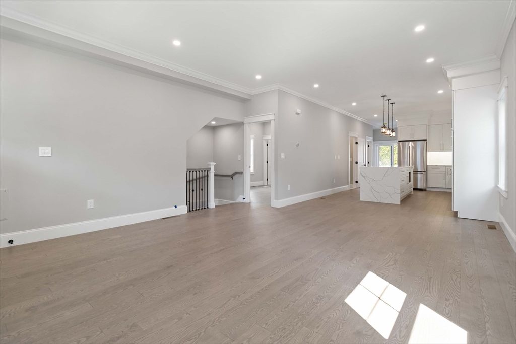 Empty room, Interior, Kitchen, Pendant Lights, Recessed Lighting, Stainless Steel Appliances, Wood Texture Flooring