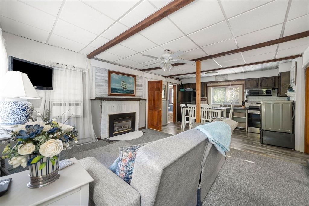 Dining room, Fireplace, Interior, Kitchen, Living room, Stainless Steel Appliances, Wood Texture Flooring