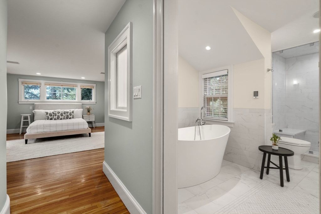 Bathroom, Free Standing Baths, Interior, Marble, Marble Walls, Recessed Lighting, Wood Texture Flooring