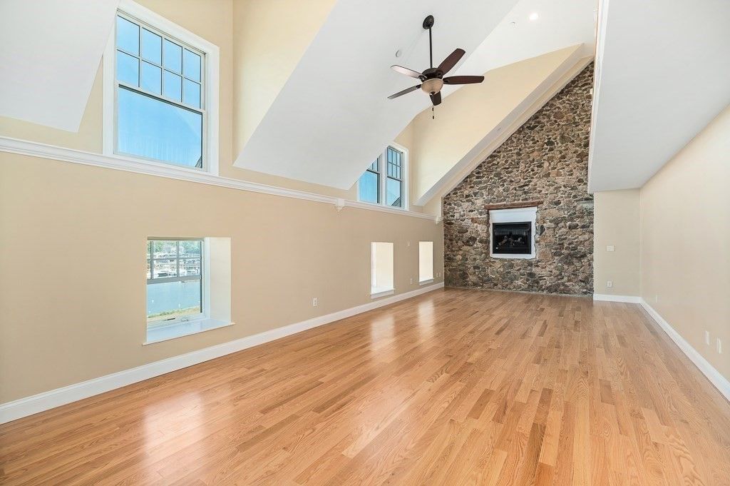 Empty room, Fireplace, Interior, Recessed Lighting, Stone Walls, Wood Texture Flooring