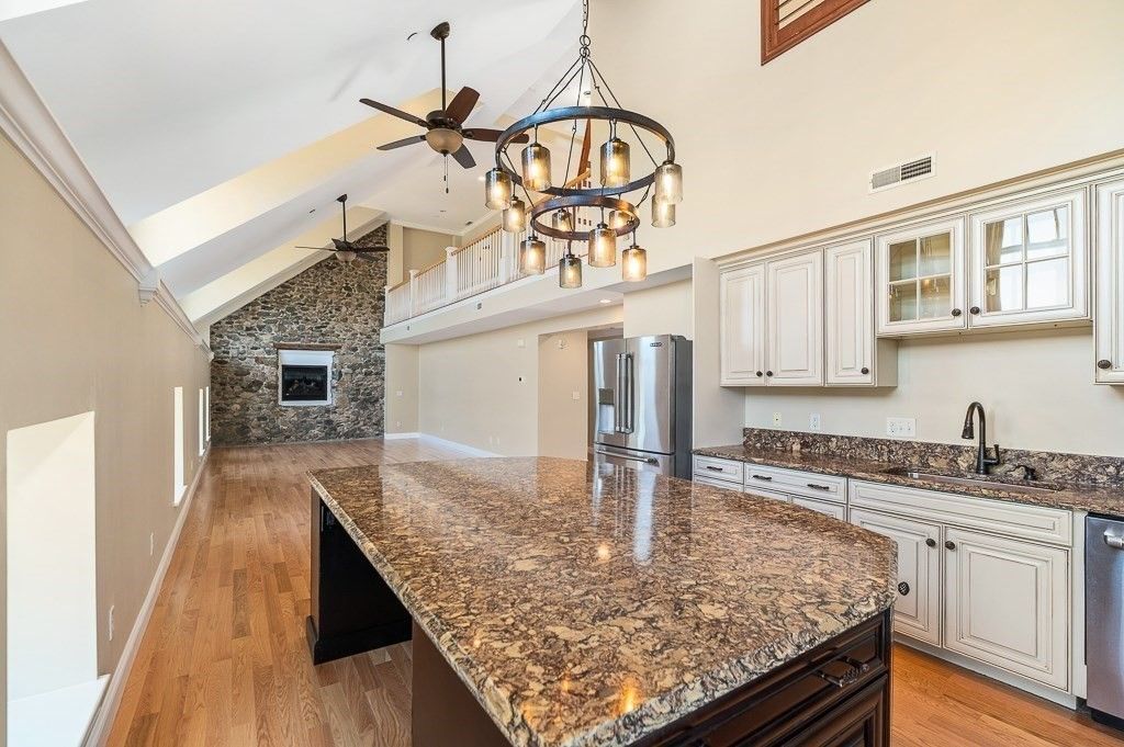 Fireplace, Interior, Kitchen, Stainless Steel Appliances, Stone Walls, Wood Texture Flooring