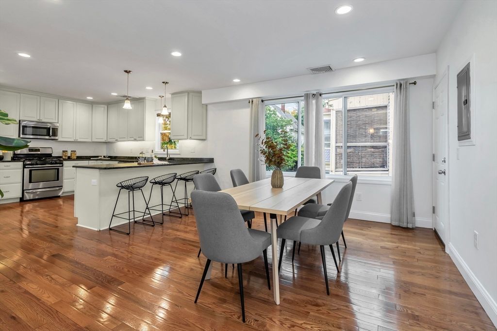 Dining room, Interior, Kitchen, Pendant Lights, Recessed Lighting, Stainless Steel Appliances, Wood Texture Flooring