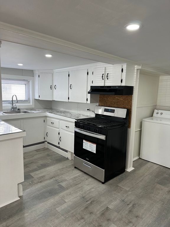 Interior, Kitchen, Recessed Lighting, Washer, Wood Texture Flooring