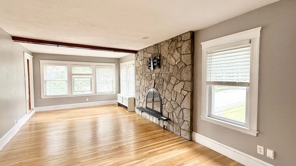 Empty room, Fireplace, Interior, Recessed Lighting, Stone Walls, Wood Texture Flooring