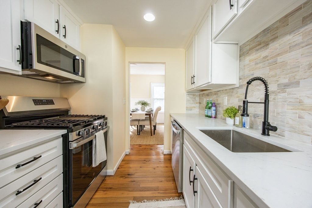 Dining room, Interior, Kitchen, Recessed Lighting, Stainless Steel Appliances, Wood Texture Flooring