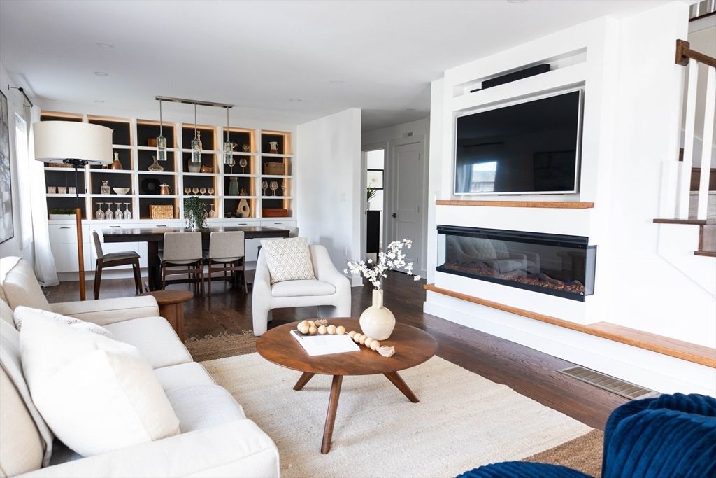 Dining room, Fireplace, Interior, Living room, Pendant Lights, Recessed Lighting, Wood Texture Flooring