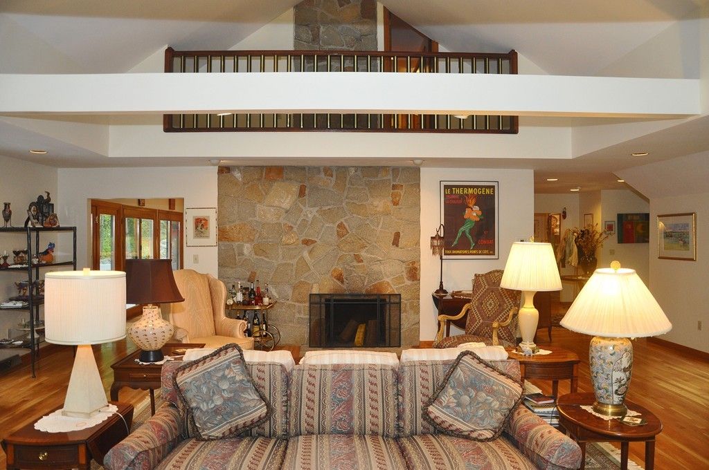 Fireplace, Interior, Living room, Recessed Lighting, Stone Walls, Wood Texture Flooring