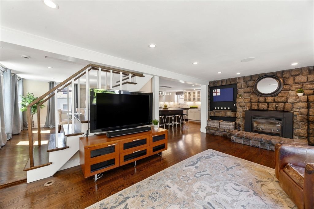 Fireplace, Interior, Living room, Recessed Lighting, Stone Walls, Wood Texture Flooring