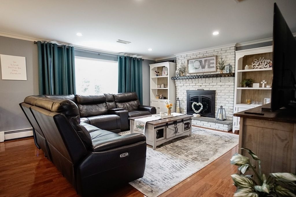 Fireplace, Interior, Living room, Recessed Lighting, Stone Walls, Wood Texture Flooring