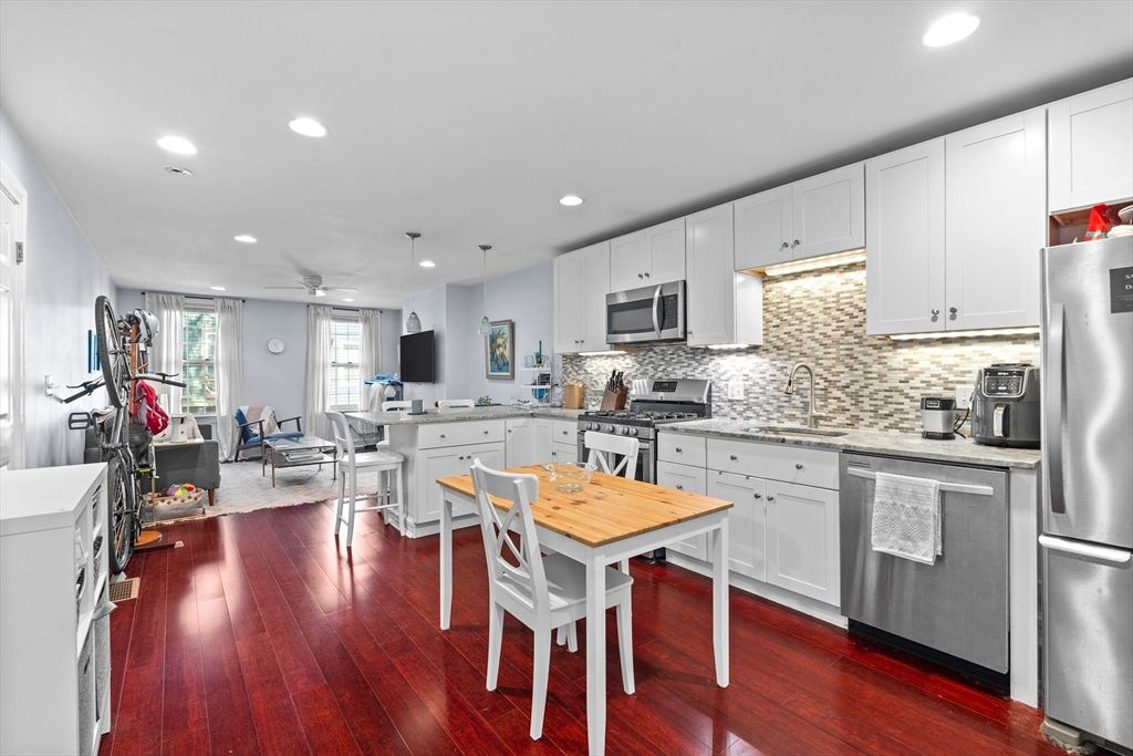 Dining room, Interior, Kitchen, Living room, Pendant Lights, Recessed Lighting, Stainless Steel Appliances, Wood Texture Flooring