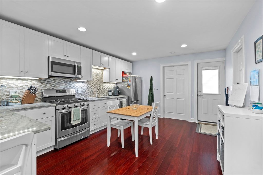 Dining room, Interior, Kitchen, Recessed Lighting, Stainless Steel Appliances, Wood Texture Flooring