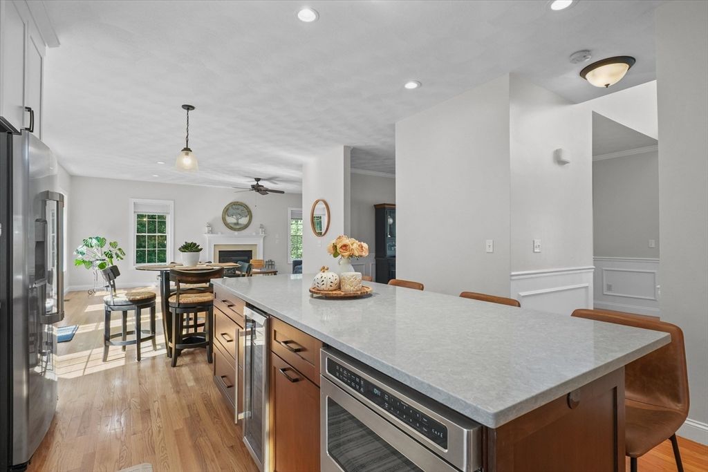 Dining room, Fireplace, Interior, Kitchen, Pendant Lights, Recessed Lighting, Stainless Steel Appliances, Wood Texture Flooring