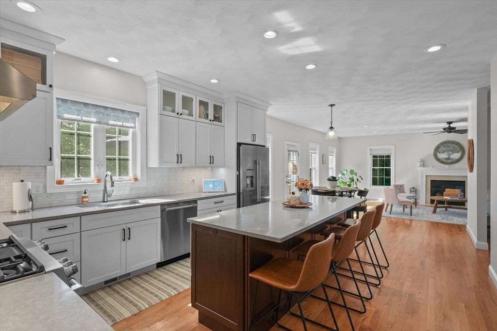 Dining room, Fireplace, Interior, Kitchen, Pendant Lights, Recessed Lighting, Stainless Steel Appliances, Wood Texture Flooring