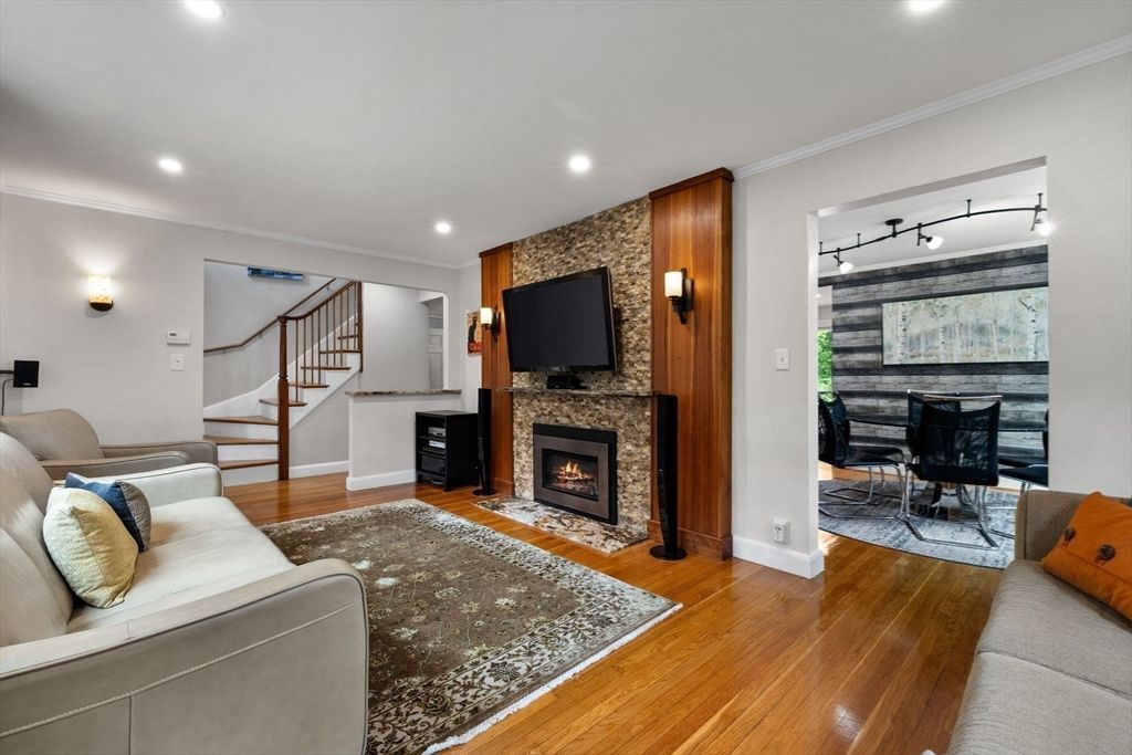 Dining room, Fireplace, Interior, Living room, Recessed Lighting, Stone Walls, Wood Texture Flooring, Wooden Walls