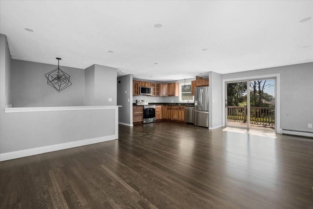 Empty room, Interior, Kitchen, Pendant Lights, Stainless Steel Appliances, Wood Texture Flooring