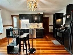 Chandelier, Interior, Kitchen, Pendant Lights, Stainless Steel Appliances, Wood Texture Flooring