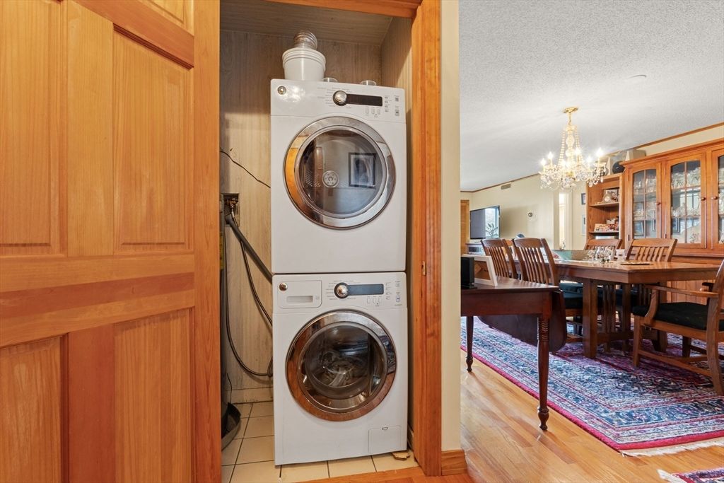 Chandelier, Dining room, Interior, Utility Closets, Washer, Wood Texture Flooring