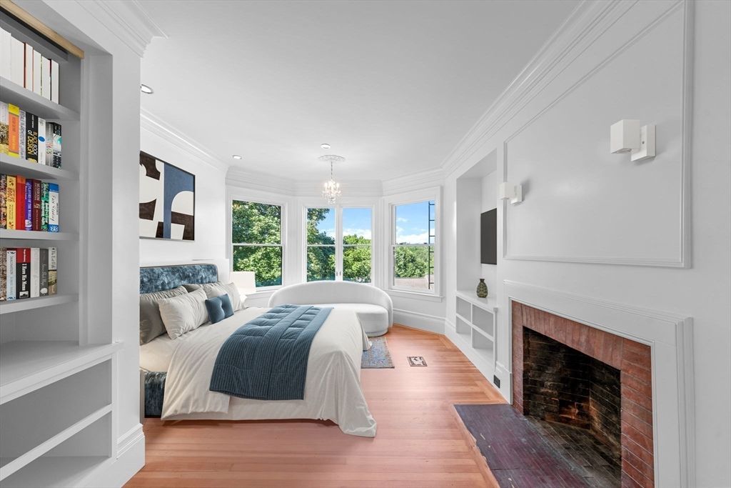 Bedroom, Chandelier, Fireplace, Interior, Recessed Lighting, Wood Texture Flooring