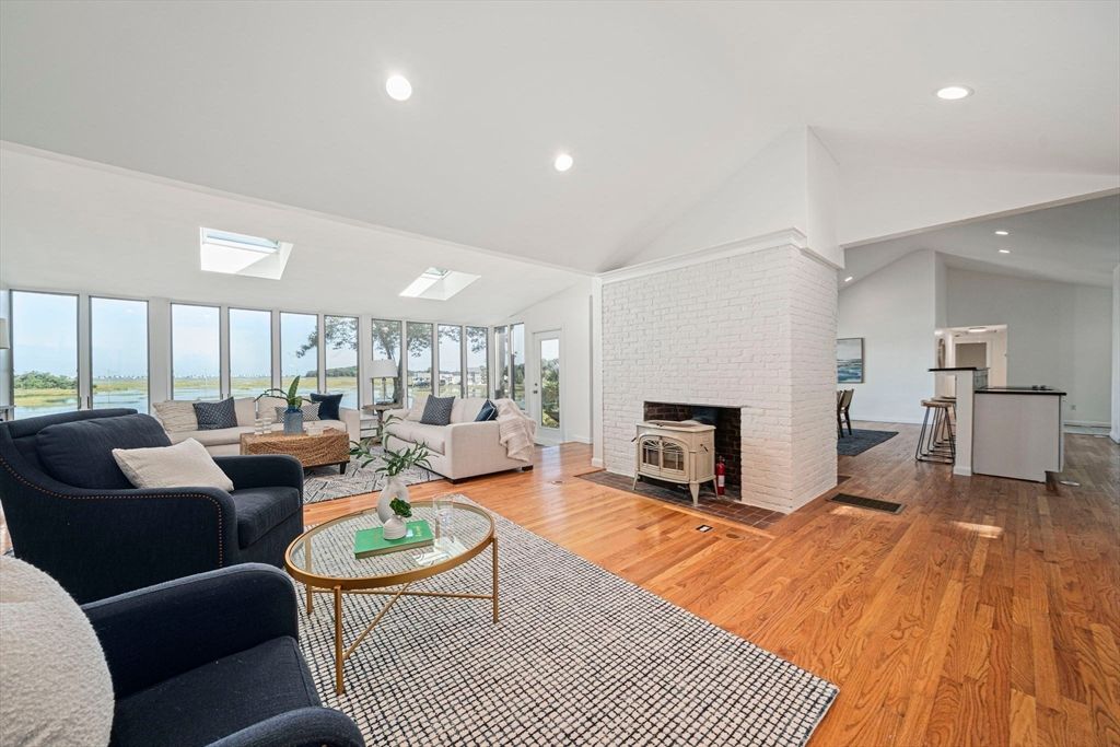 Fireplace, Interior, Living room, Recessed Lighting, Stone Walls, Wood Texture Flooring