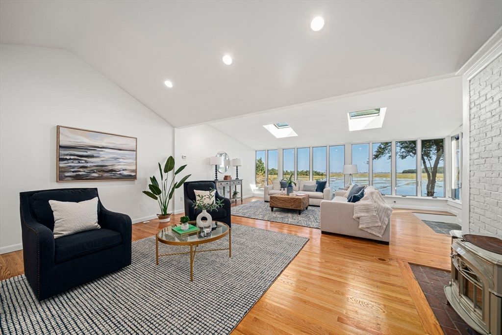 Fireplace, Interior, Living room, Recessed Lighting, Stone Walls, Water, Wood Texture Flooring